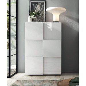 Elegante mobile bianco con pannelli a UFO, design moderno e minimalista, perfetto per arredi contemporanei in soggiorno o ingresso, con luce decorativa sopra e accessori di stile.