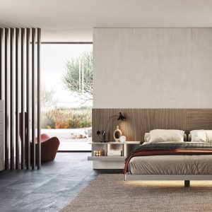 Elegante camera da letto moderna con arredi in legno e tonalità neutre, illuminata da luce naturale, perfetta per uno stile di vita contemporaneo e raffinato.