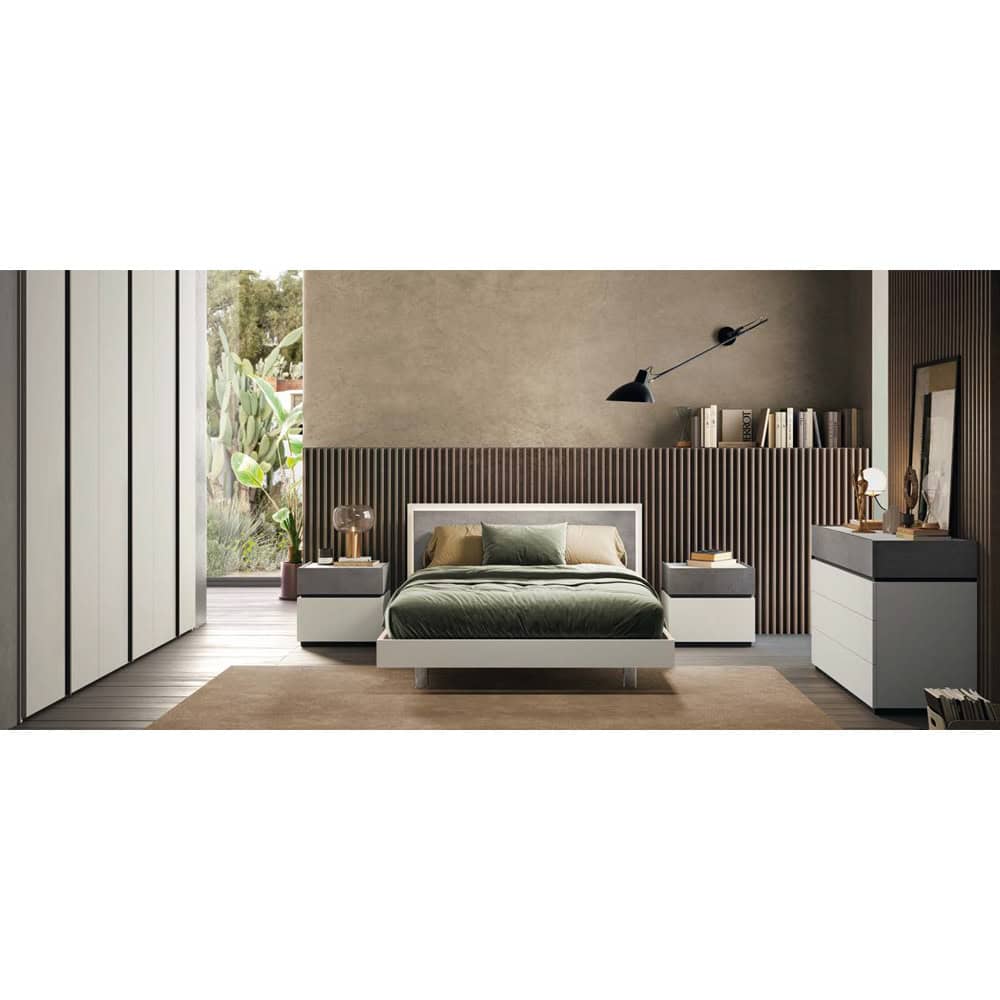 VOLO 011 Camera da letto moderna con arredi in stile minimalista, pareti in tonalità neutre e dettagli in legno, ambiente luminoso e accogliente.