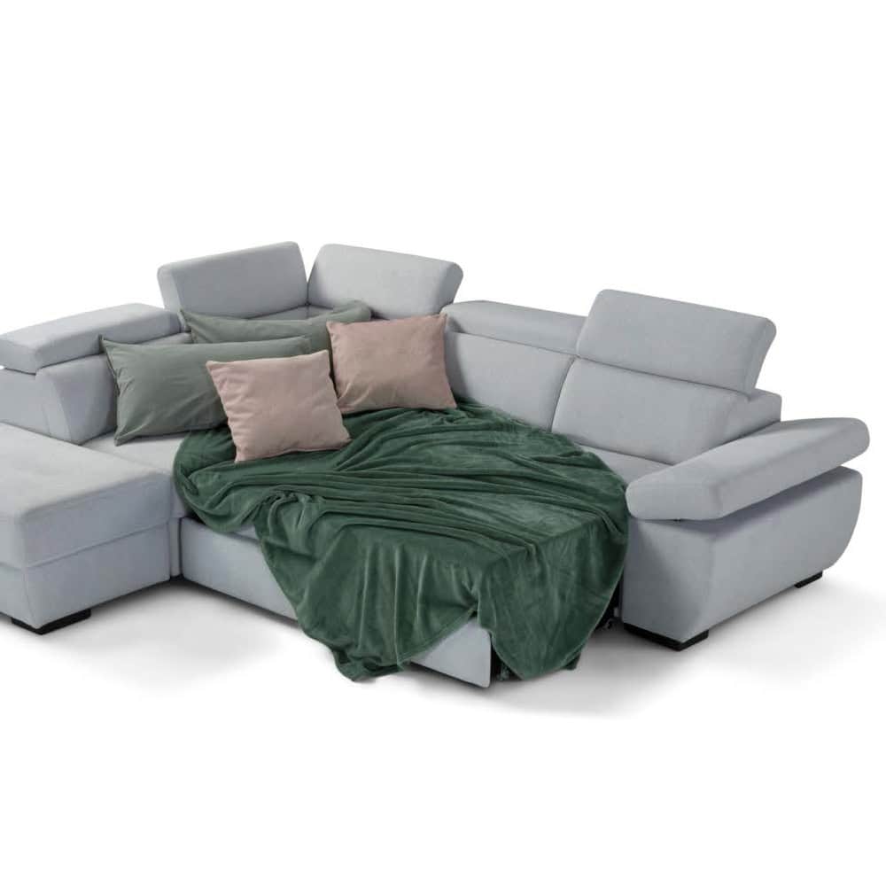 6 Divano angolare moderno con cuscini e coperta verde, arredamento di alta qualità per soggiorno elegante.